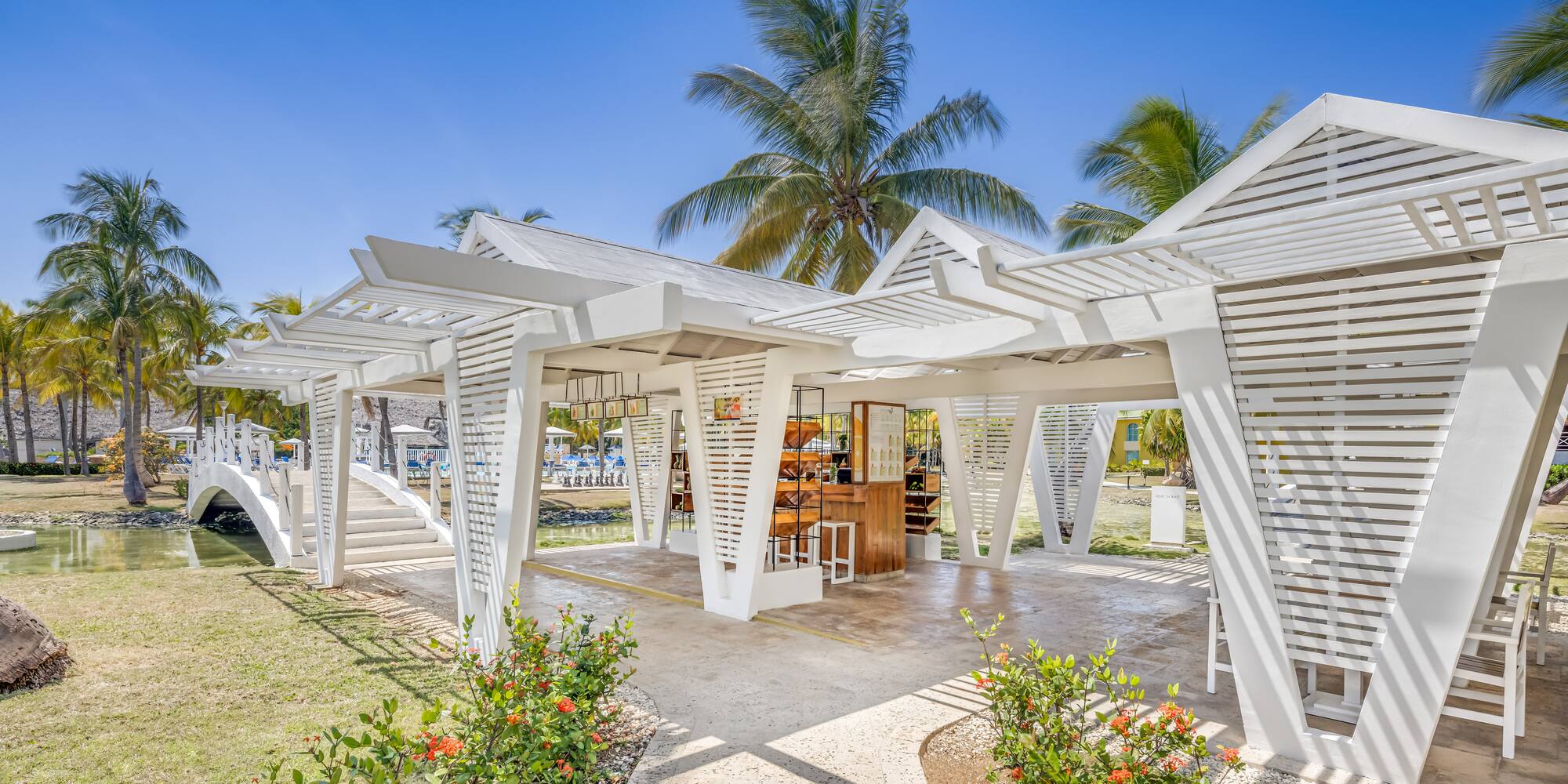 a white structure with a bar and chairs