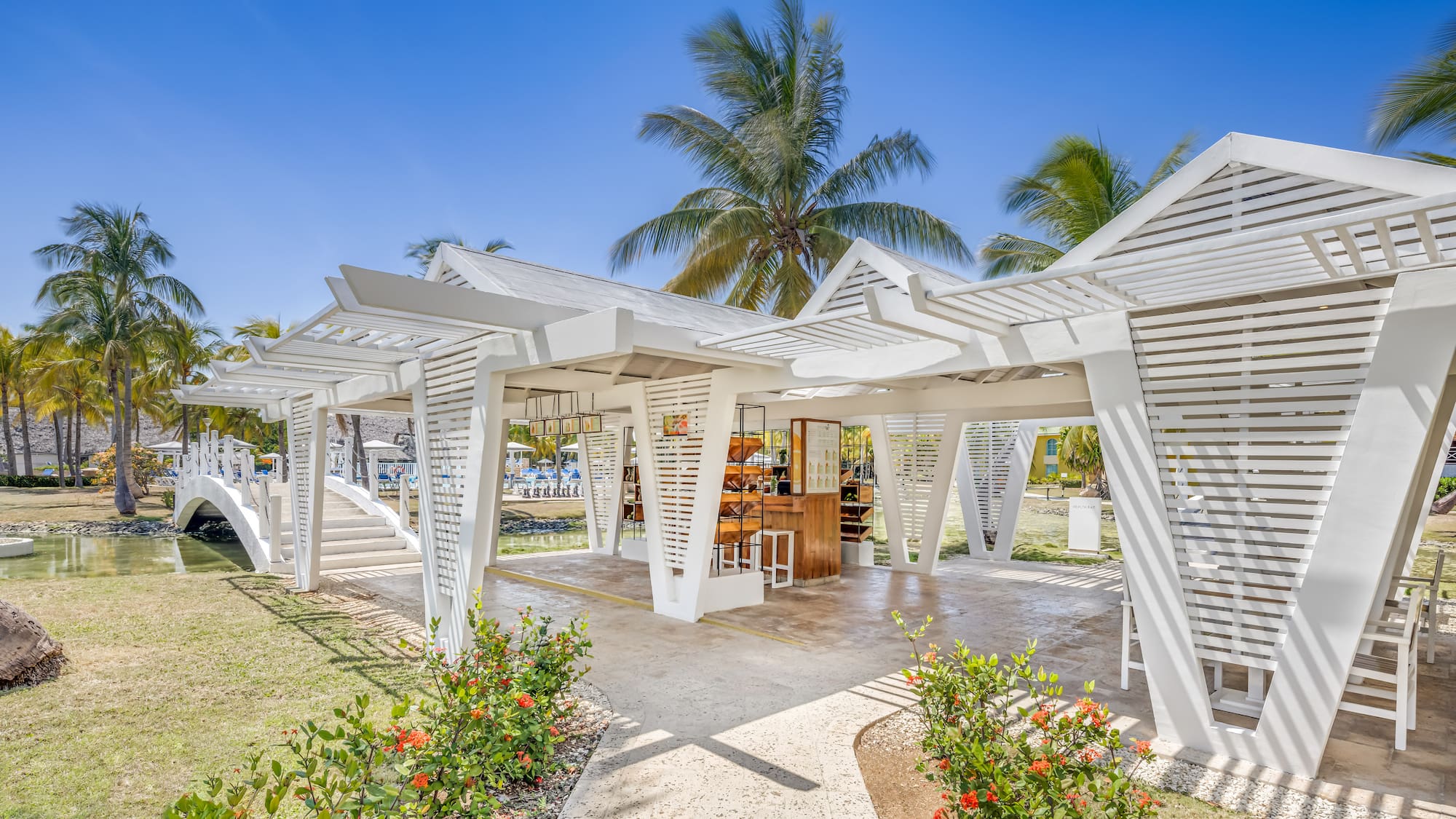 a white structure with a bar and chairs