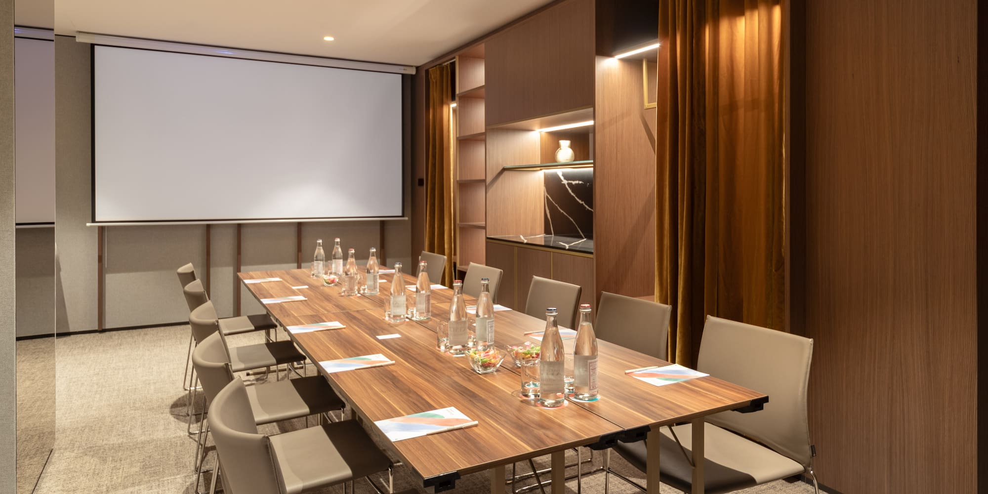 a conference room with a table and chairs