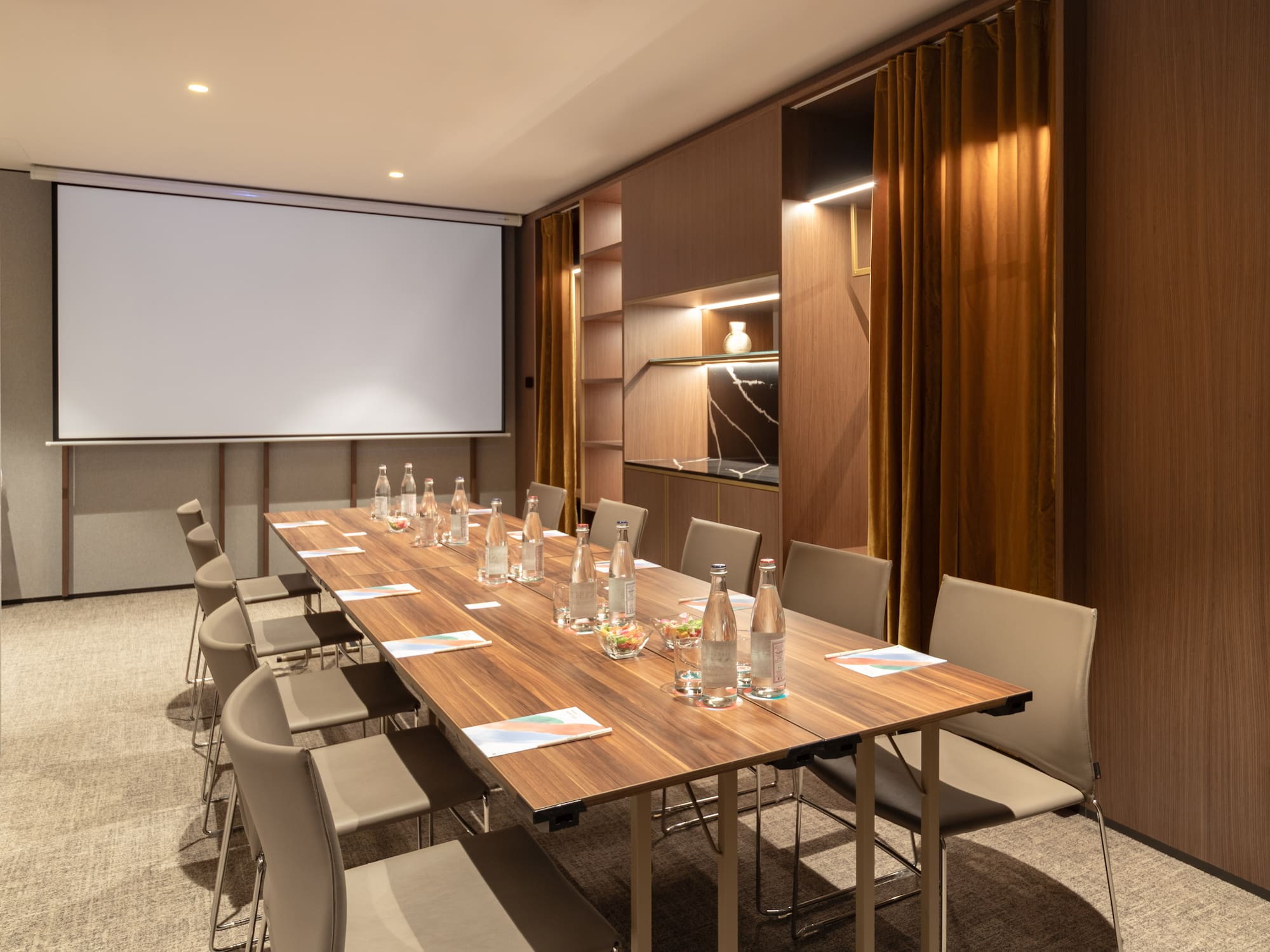 a conference room with a table and chairs