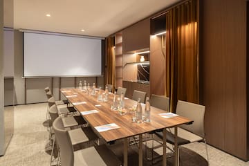 a conference room with a table and chairs