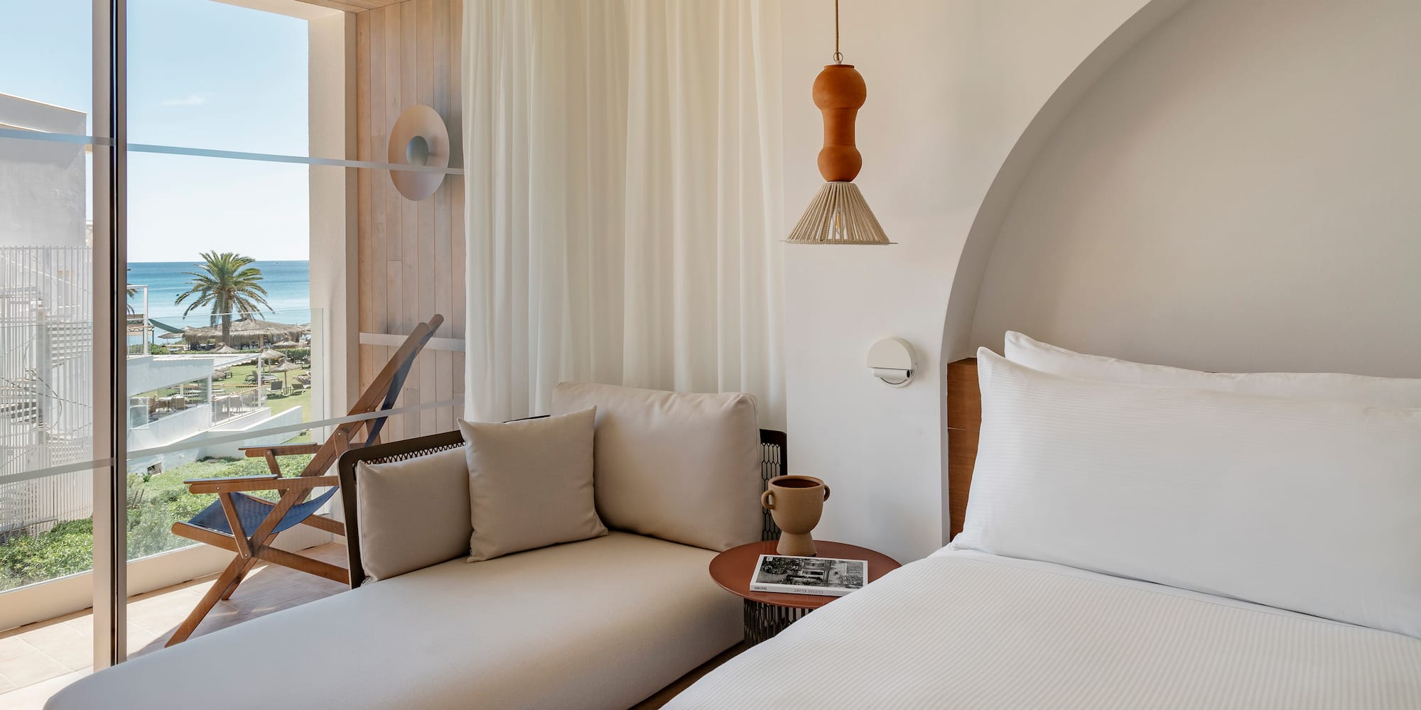 a room with a bed and a chair