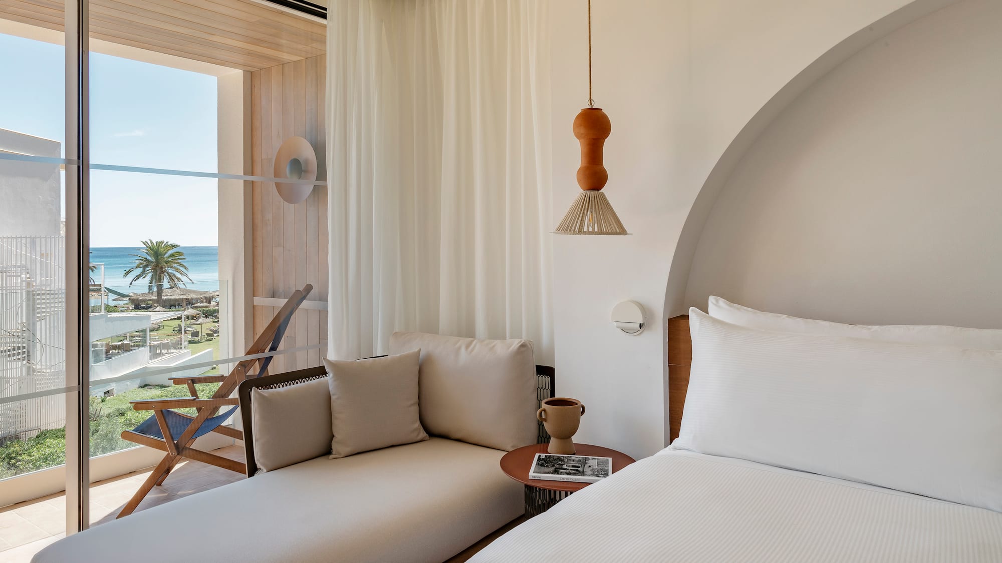 a room with a bed and a chair