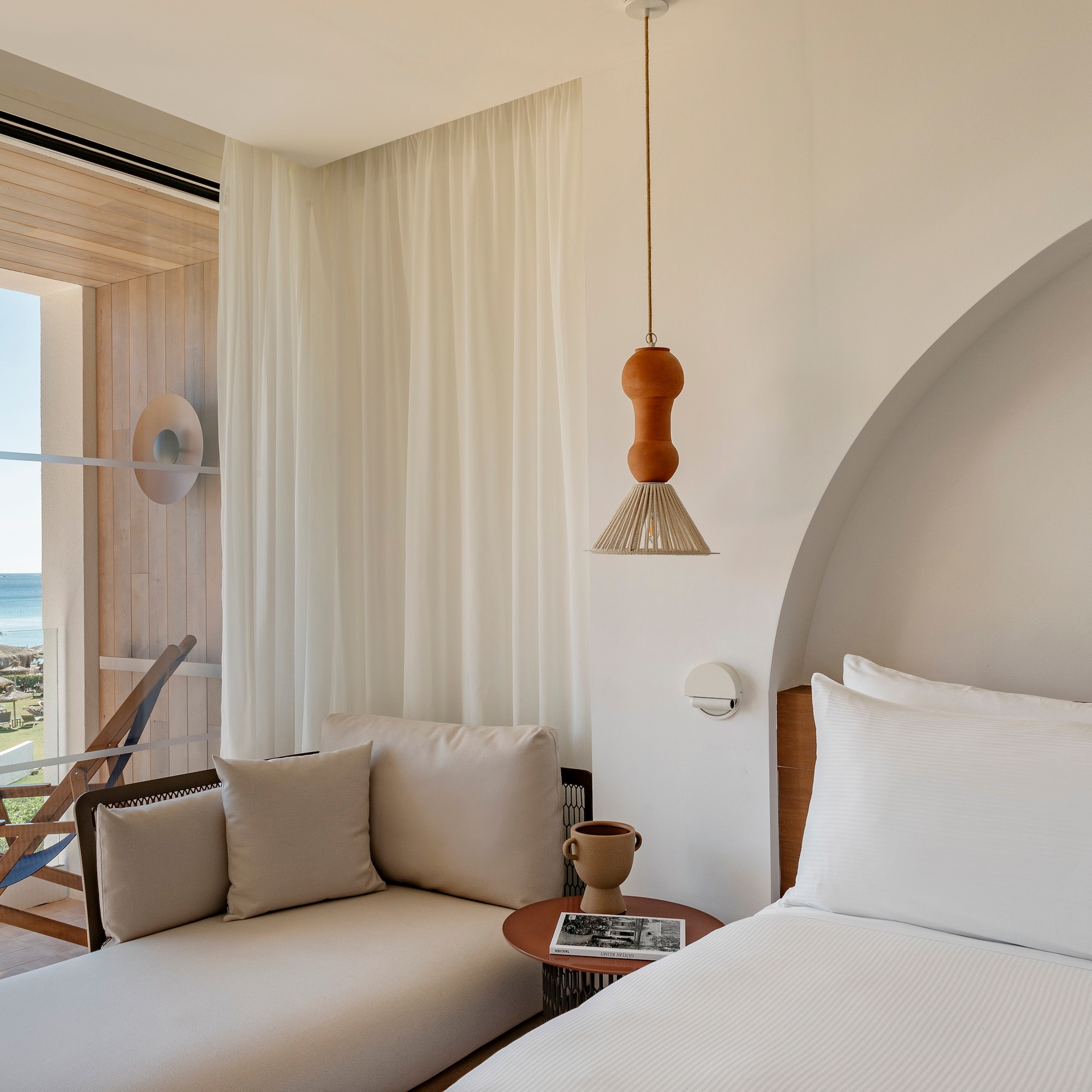 a room with a bed and a chair