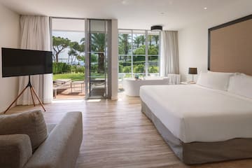 a room with a bed and a television