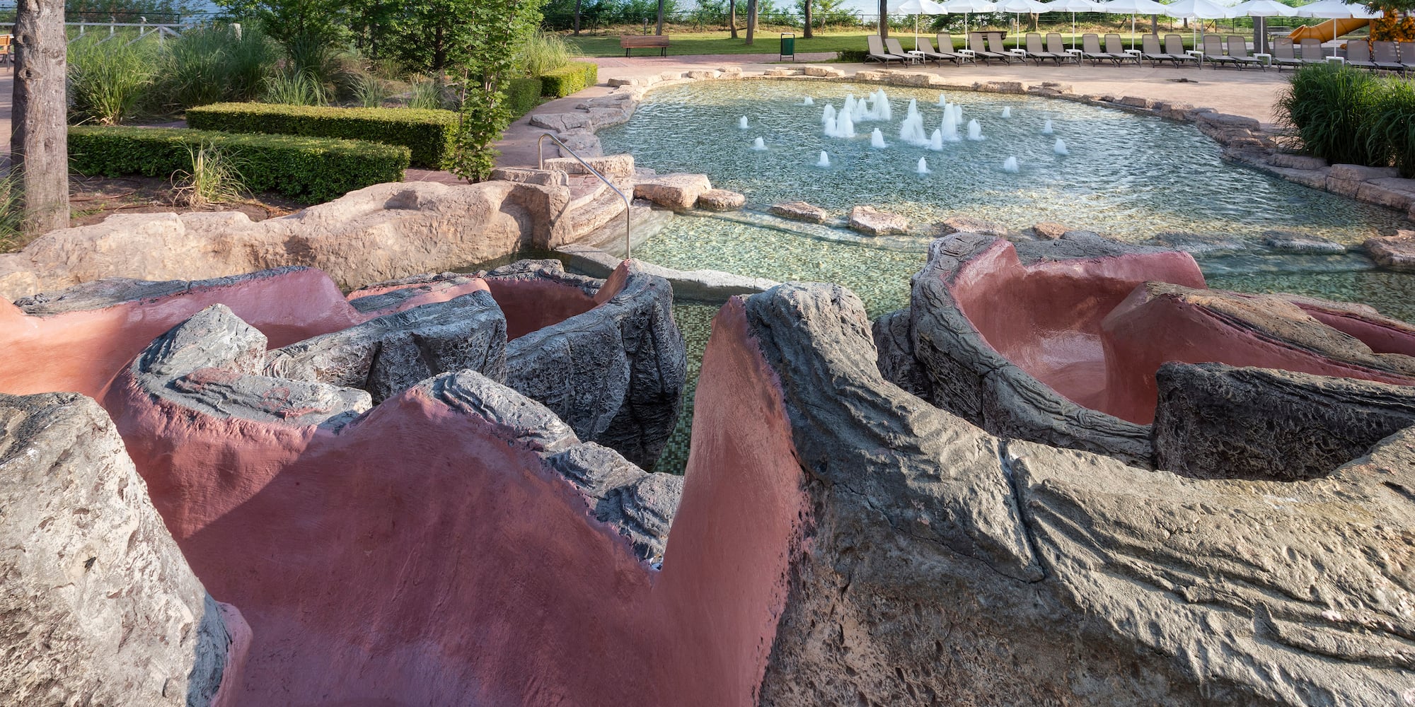 a pool with water and rocks