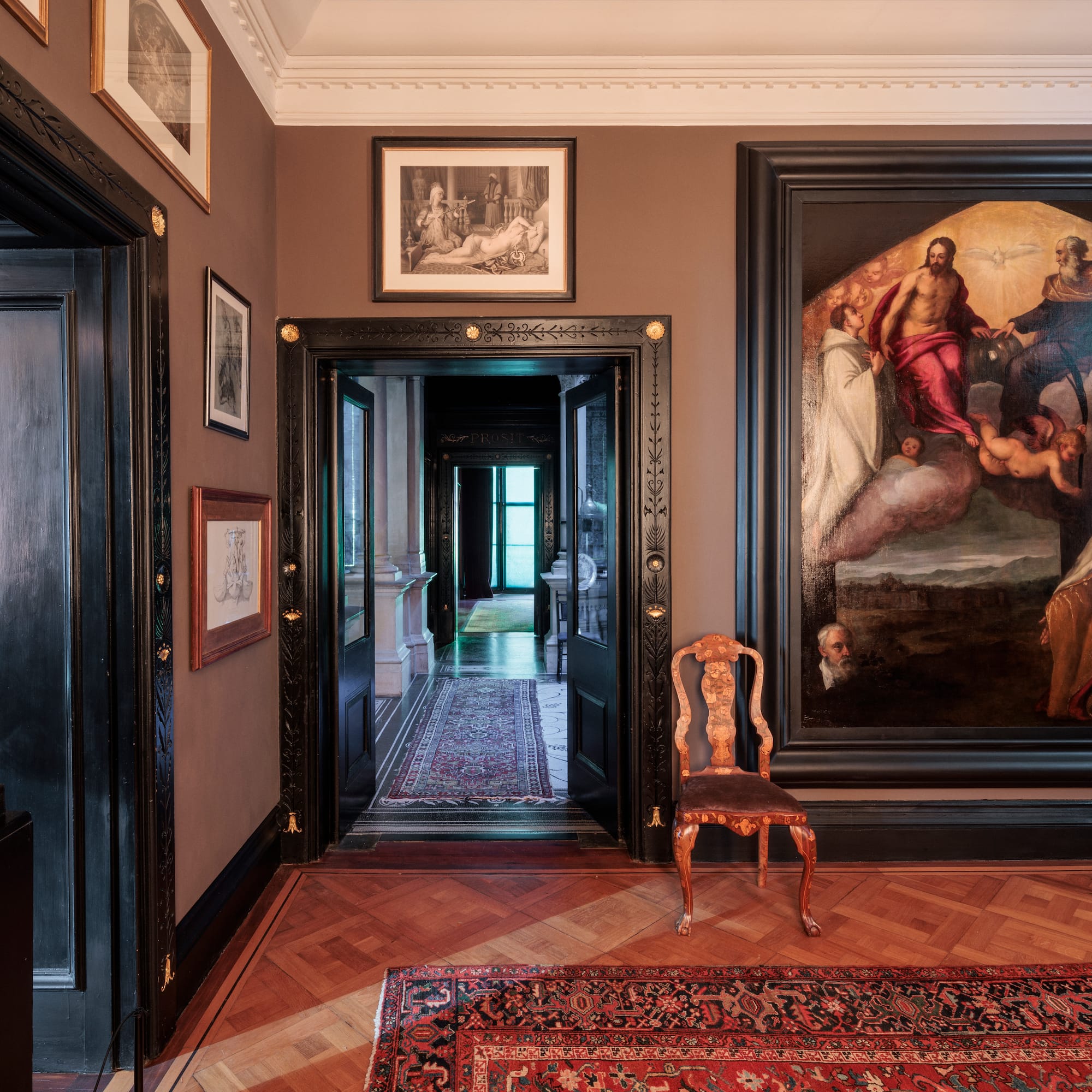 a room with a painting on the wall