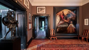 a room with a painting on the wall