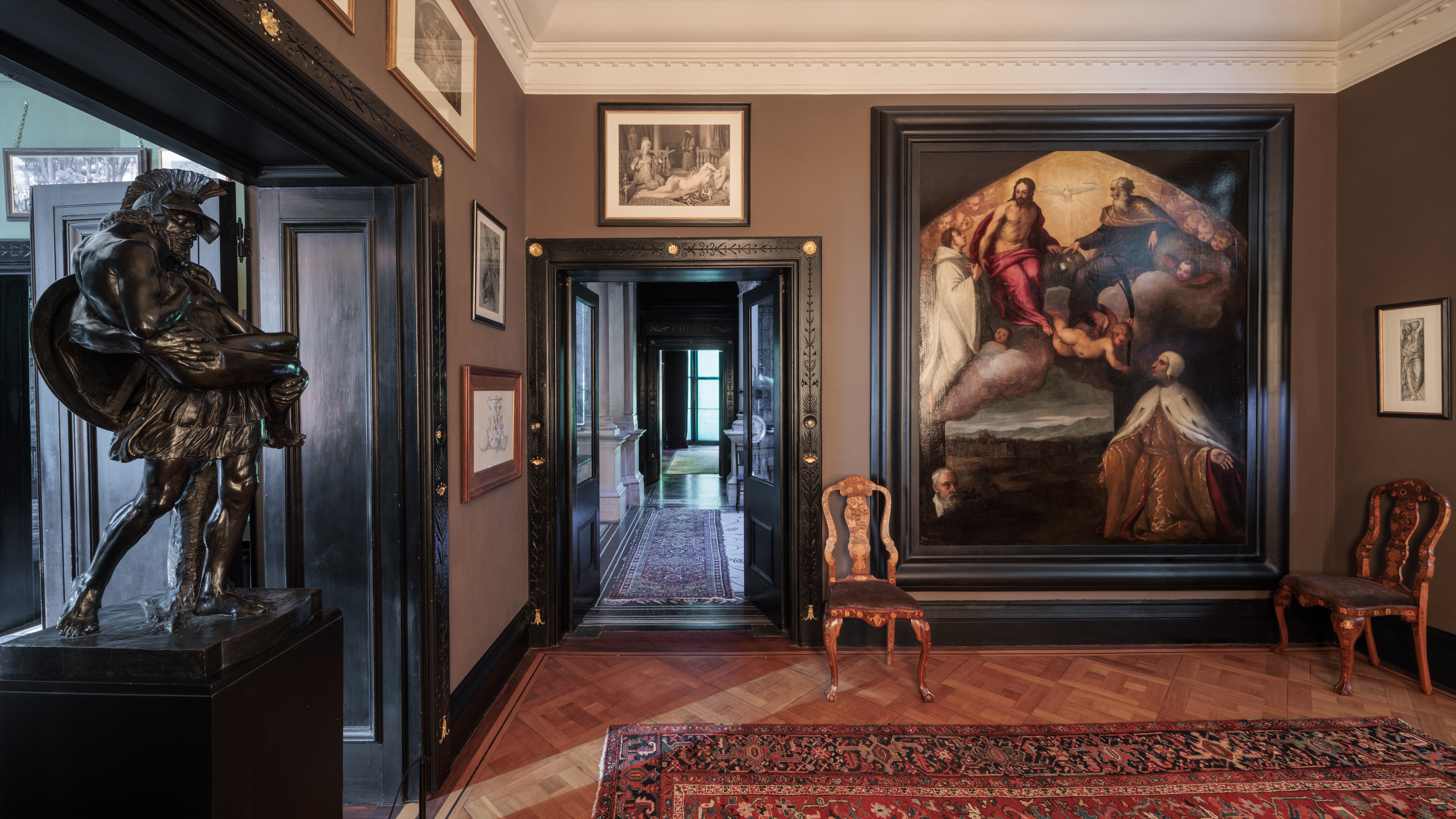 a room with a painting on the wall