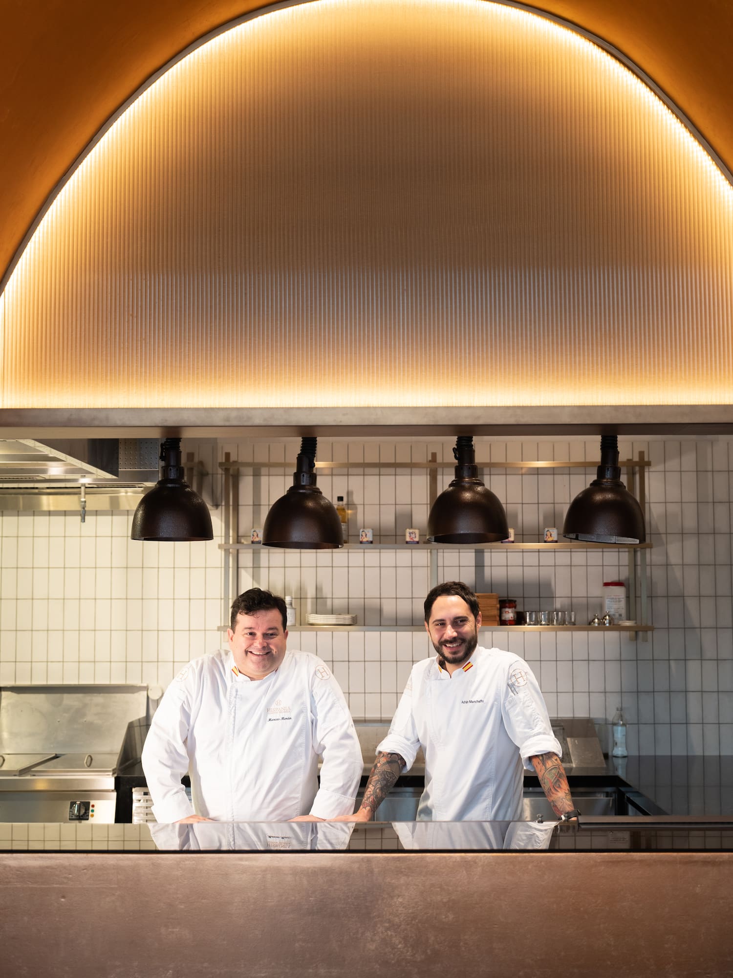 two men standing in a kitchen