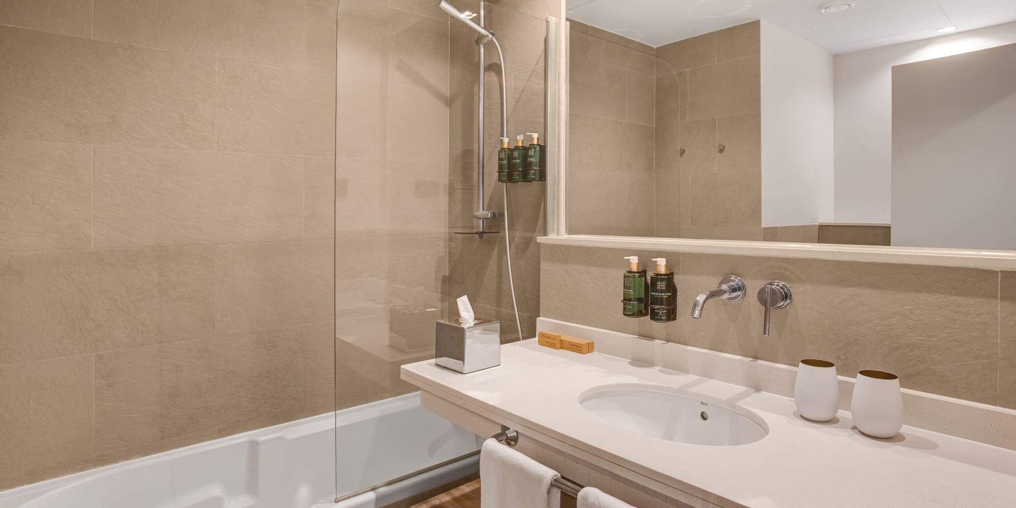 a bathroom with a shower and sink