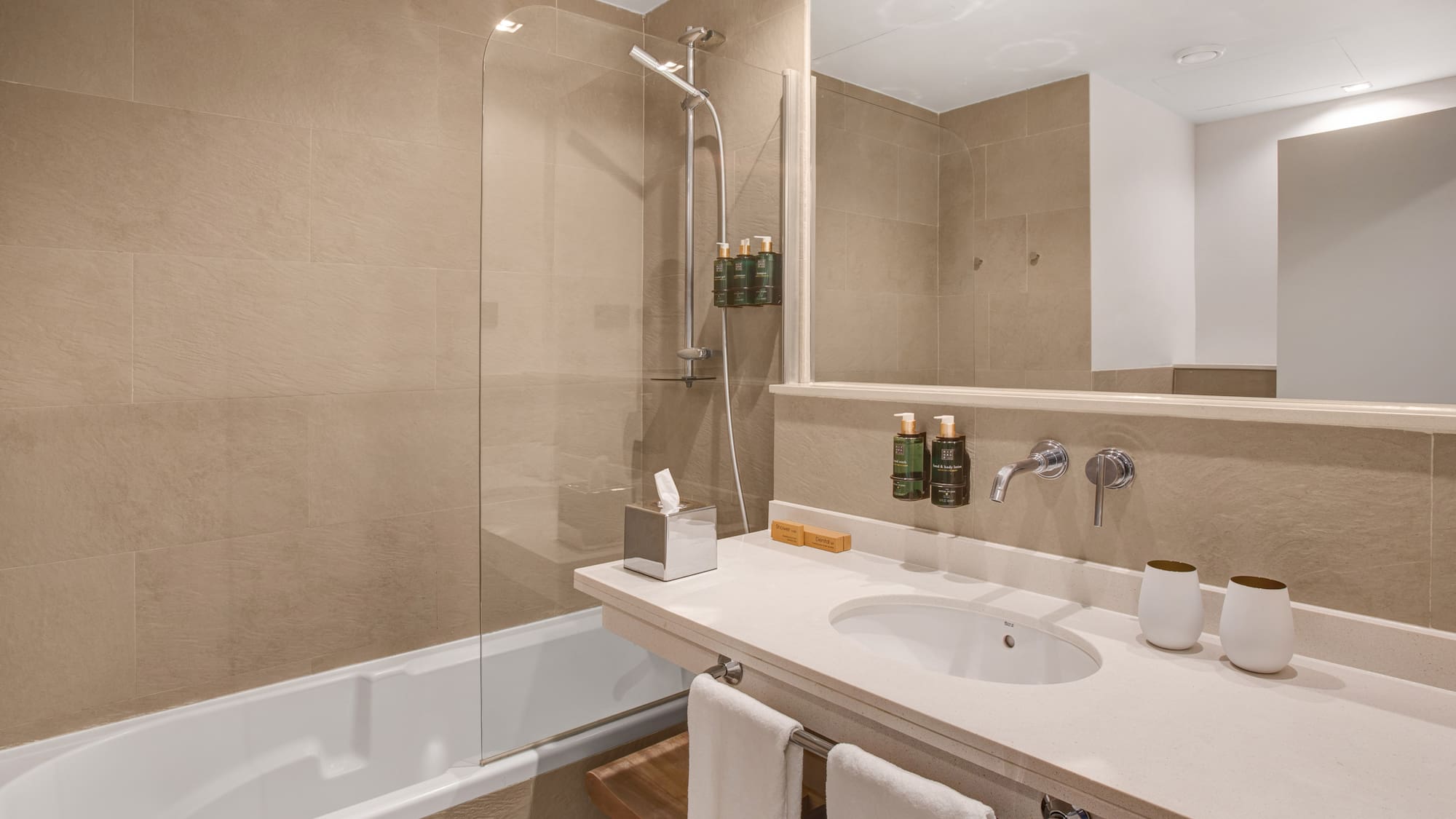 a bathroom with a shower and sink