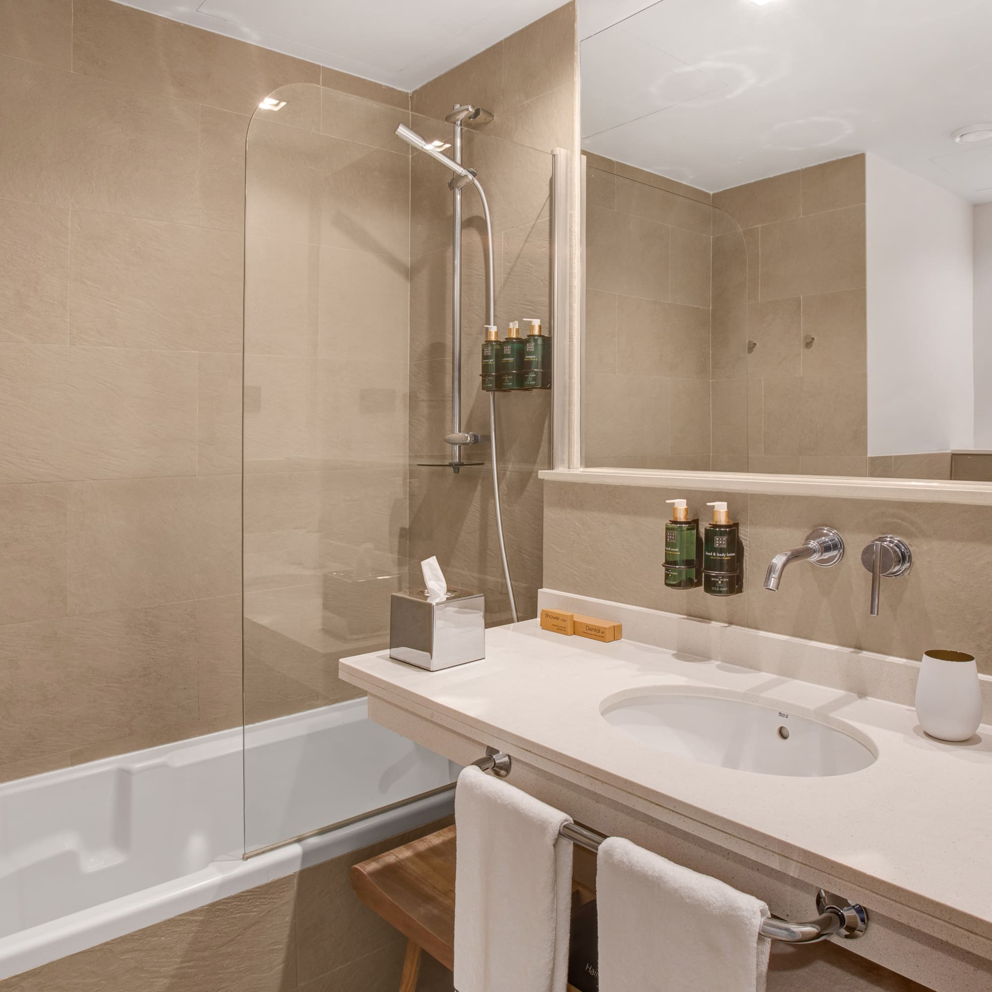 a bathroom with a shower and sink