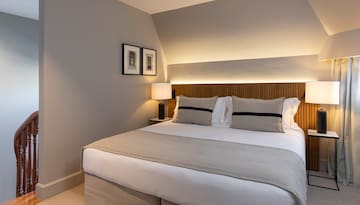 a bed with a lamp on the side