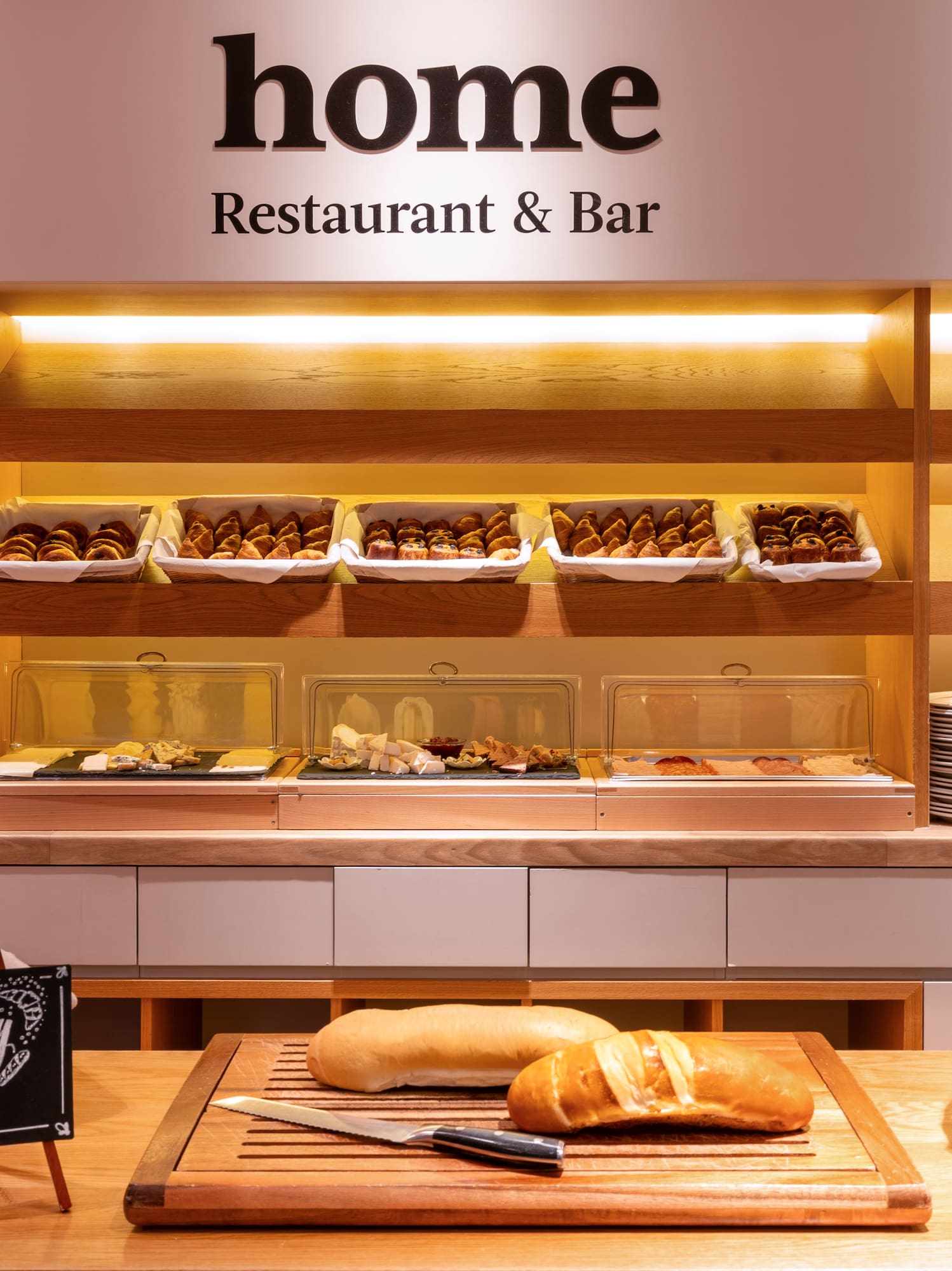 a bakery display with bread and pastries