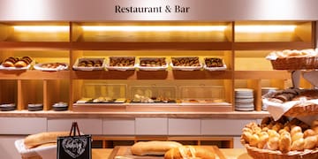 a bakery display with bread and pastries