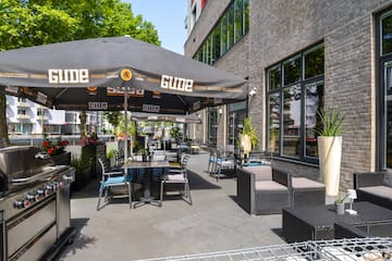 a patio with chairs and umbrellas