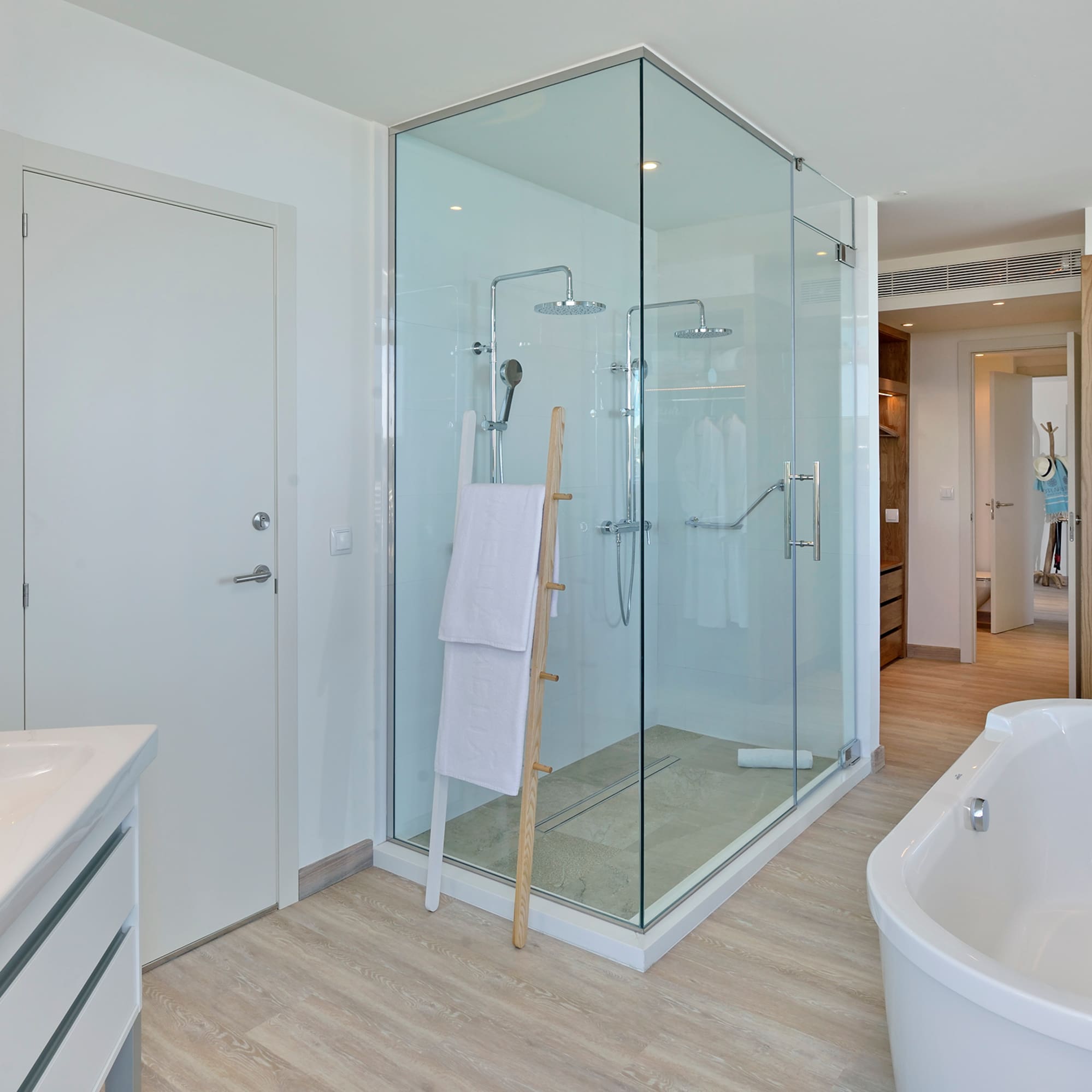 a bathroom with a tub and shower