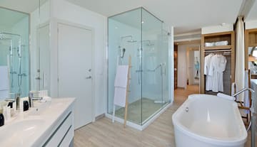 a bathroom with a tub and shower