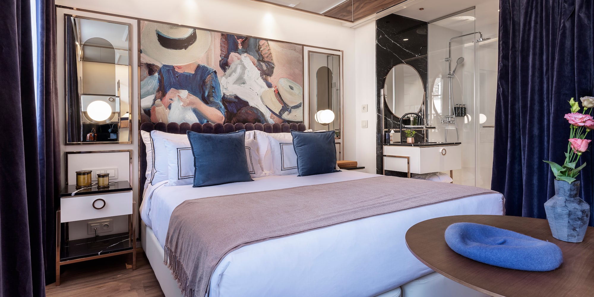 a bedroom with a bed and a round table