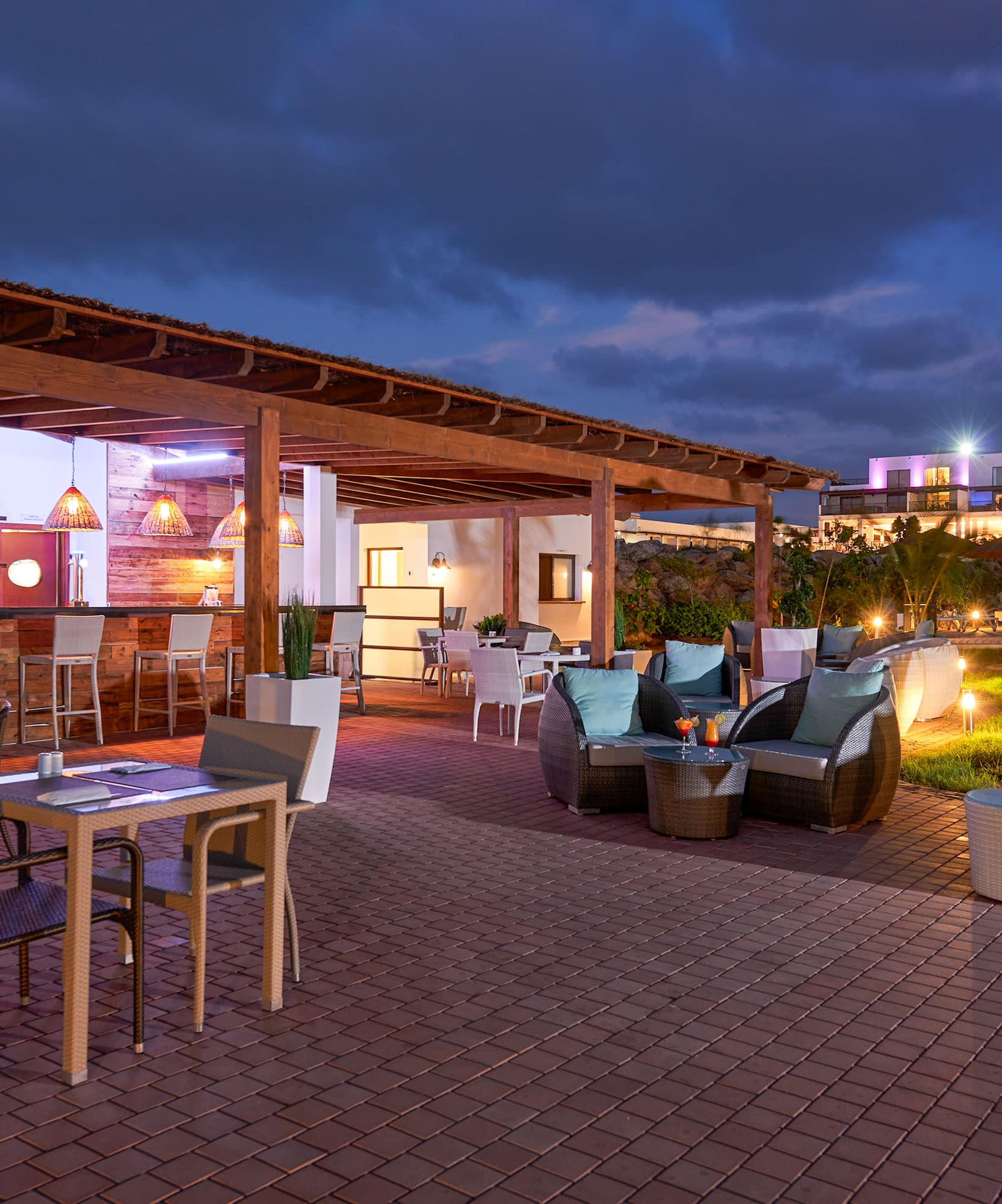 a patio with chairs and tables