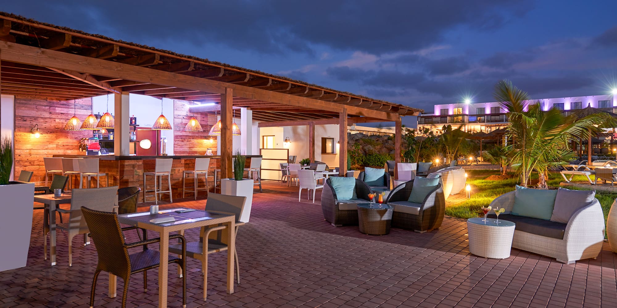 a patio with chairs and tables