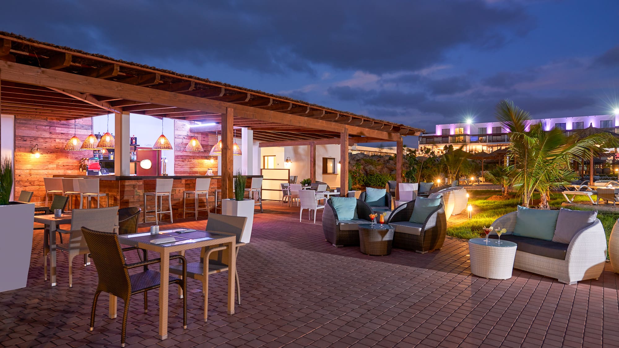 a patio with chairs and tables