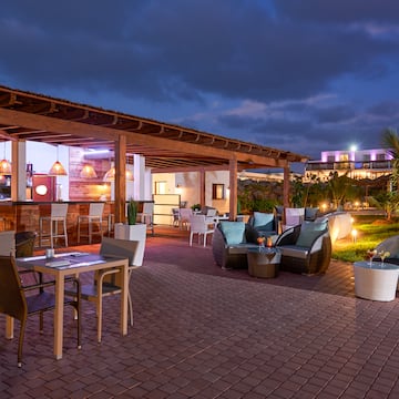 a patio with chairs and tables