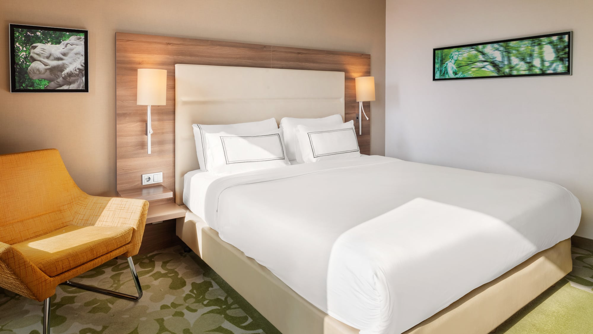 a bed with white sheets and a chair in a room