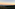Sunrise over green valleys, distant Rock of Gibraltar, city, and wind turbines.