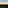 Sunrise over green valleys, distant Rock of Gibraltar, city, and wind turbines.