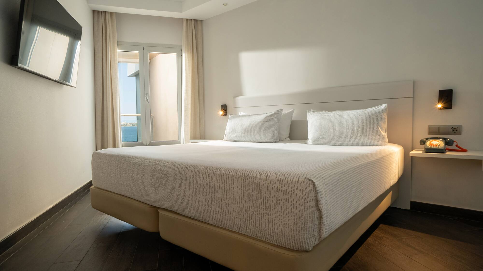 a bed with a light on the side