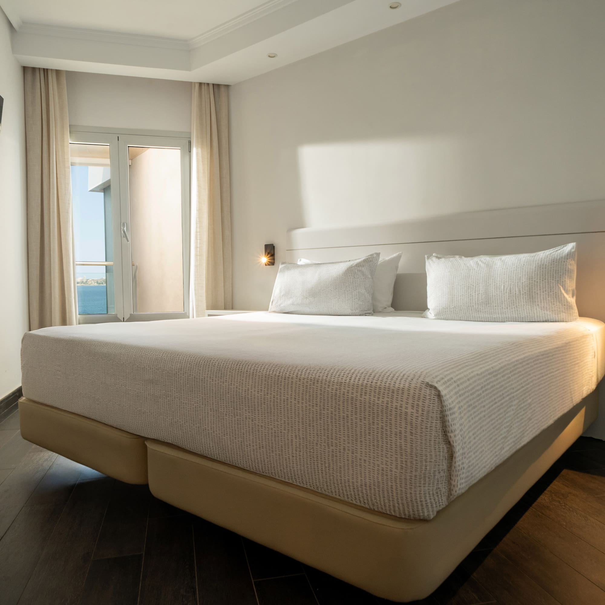 a bed with a light on the side