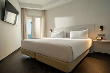 a bed with a light on the side