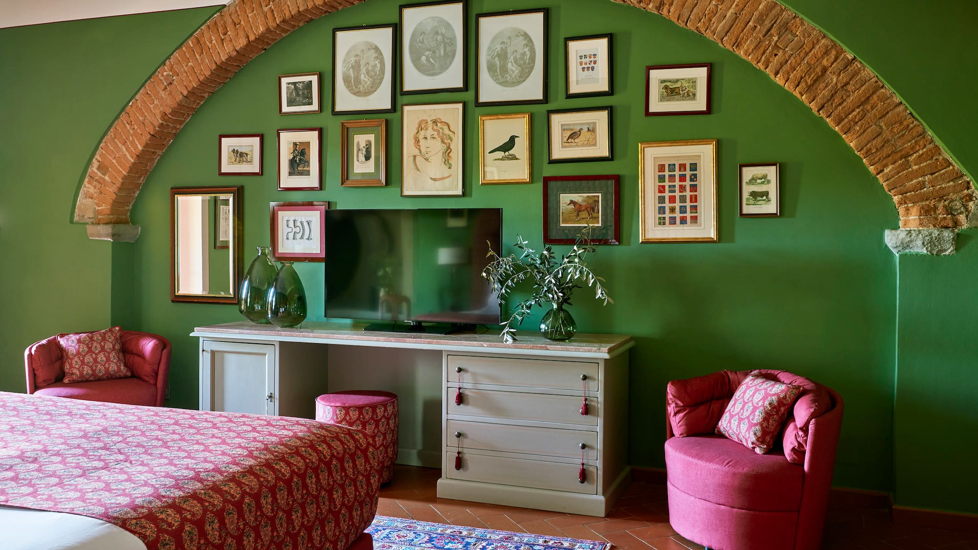 a room with a bed and a television