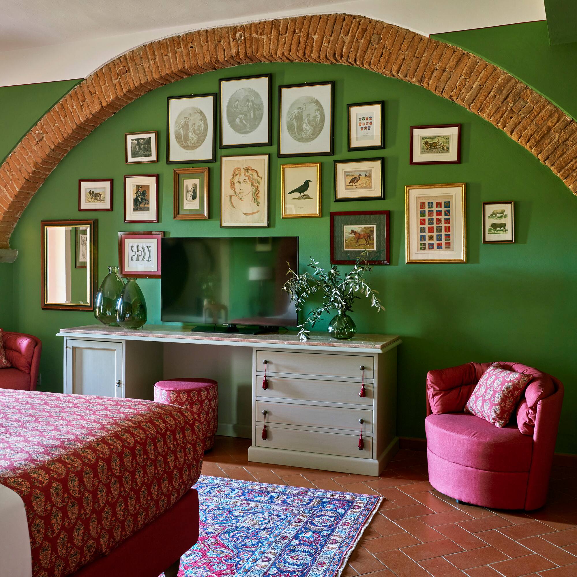 a room with a bed and a television