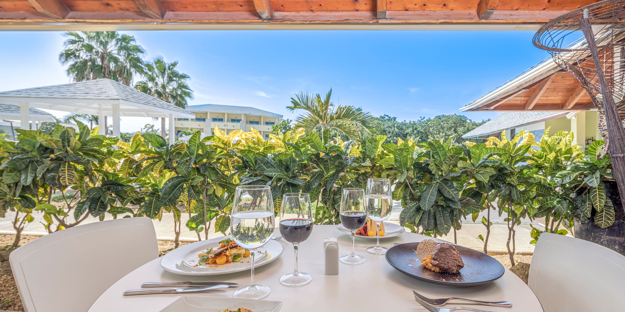 a table with food and wine glasses on it