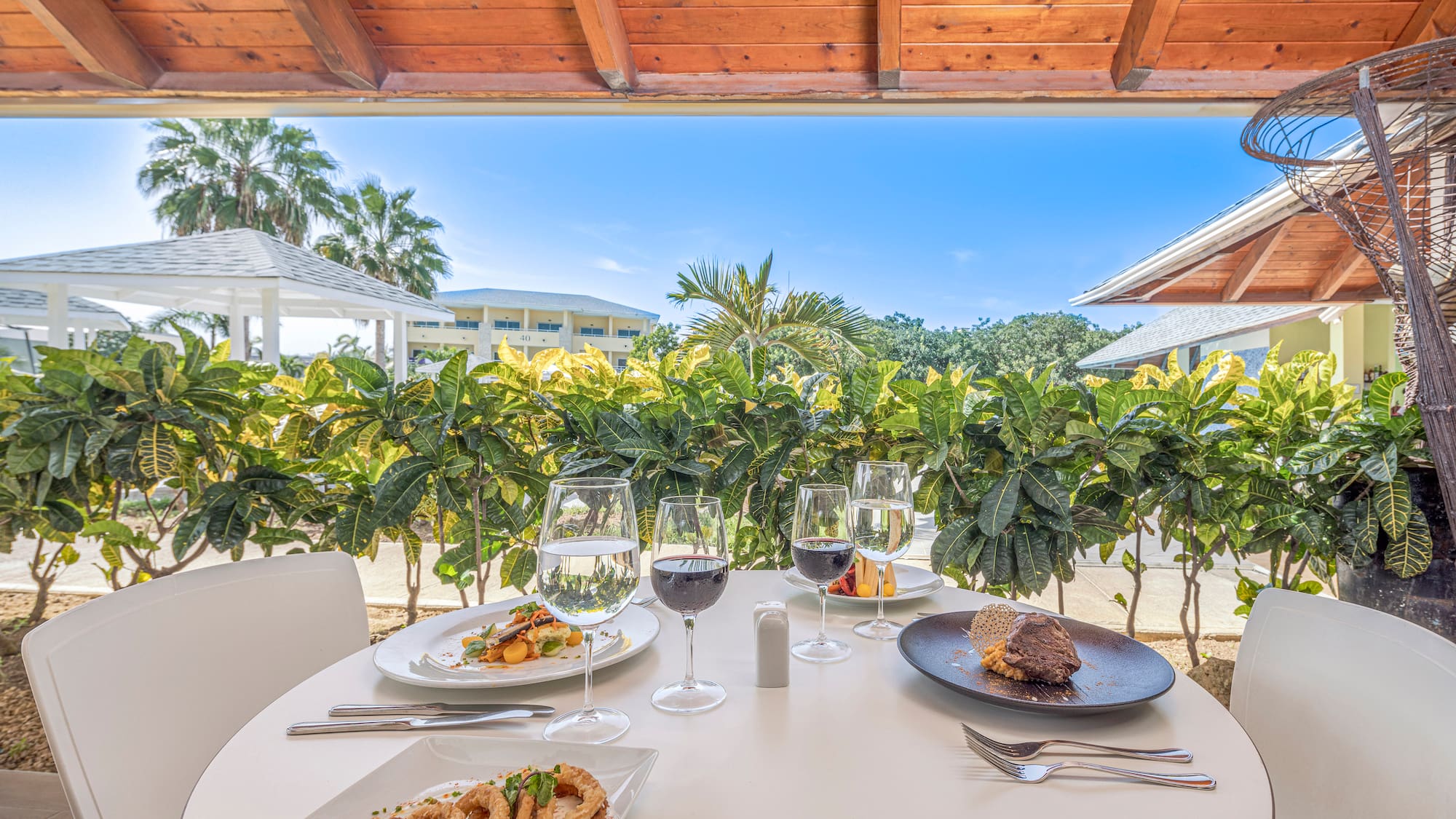 a table with food and wine glasses on it