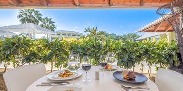 a table with food and wine glasses on it