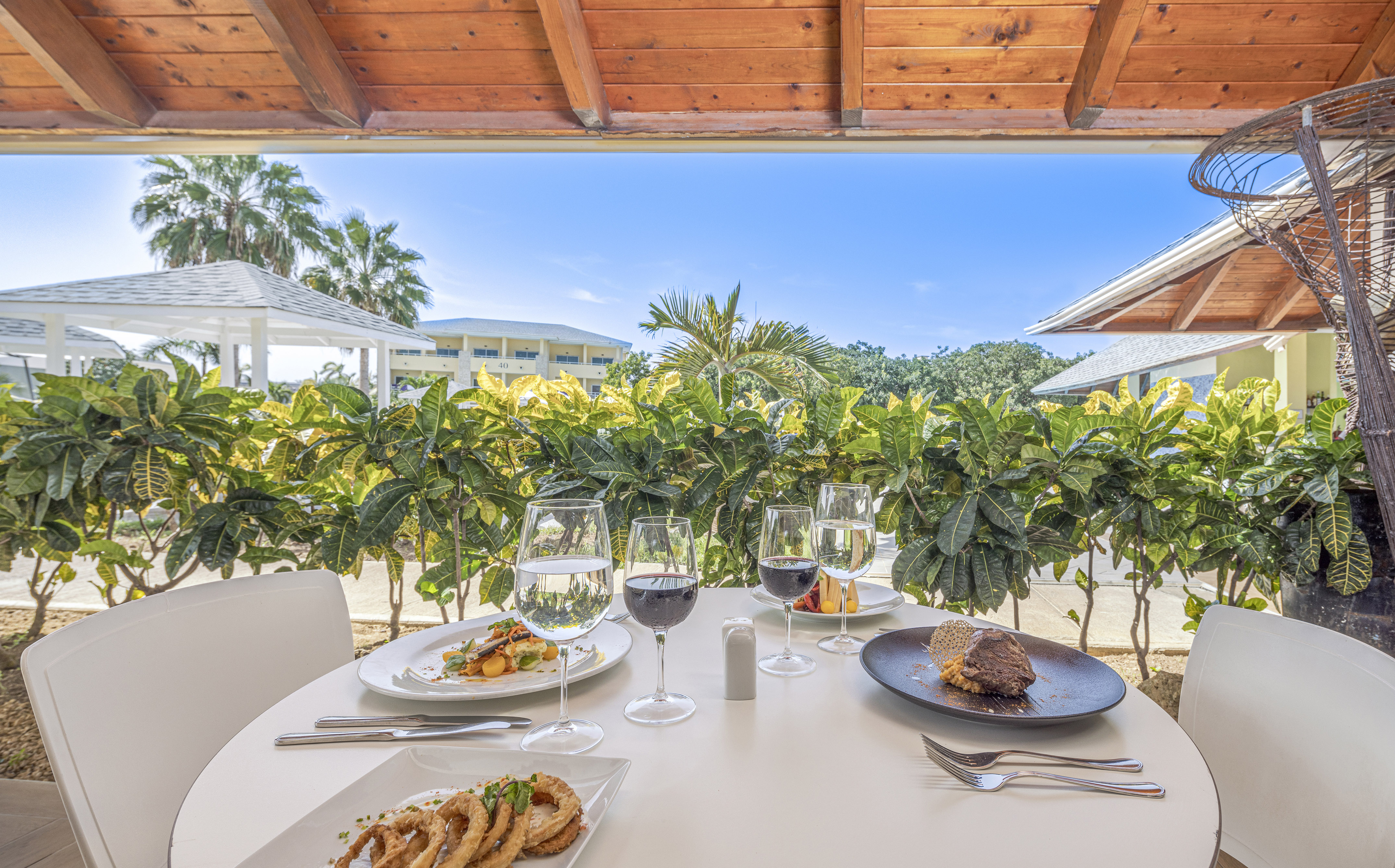 a table with food and wine glasses on it