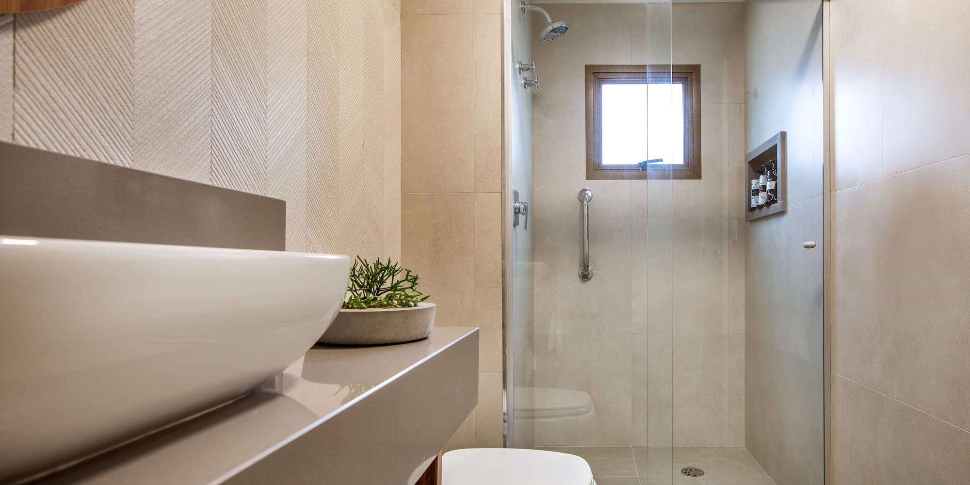 a bathroom with a glass shower door