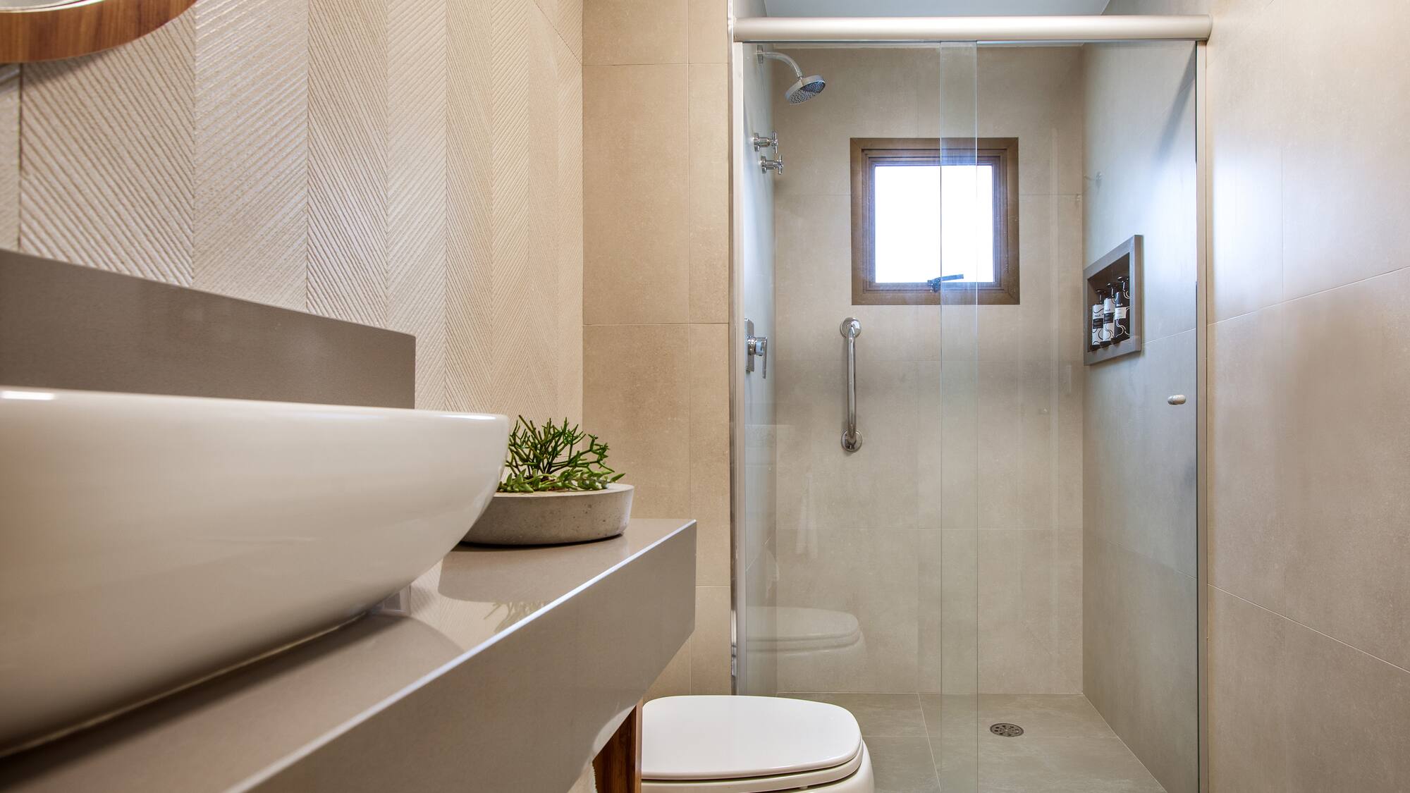 a bathroom with a glass shower door