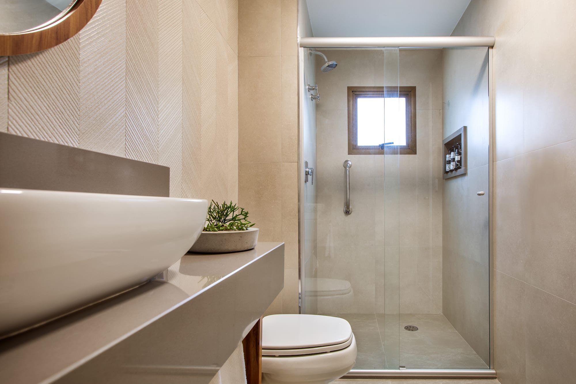 a bathroom with a glass shower door