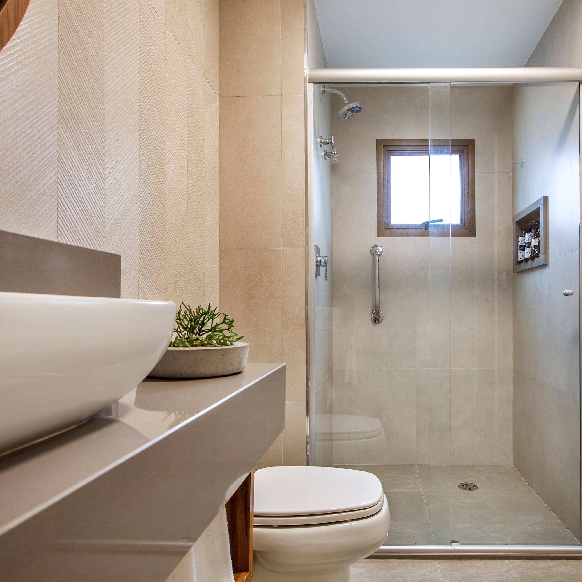 a bathroom with a glass shower door