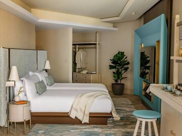 a room with a bed and a mirror
