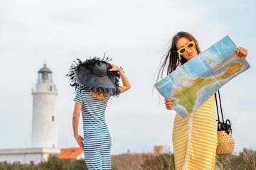 two women looking at a map