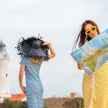 two women looking at a map