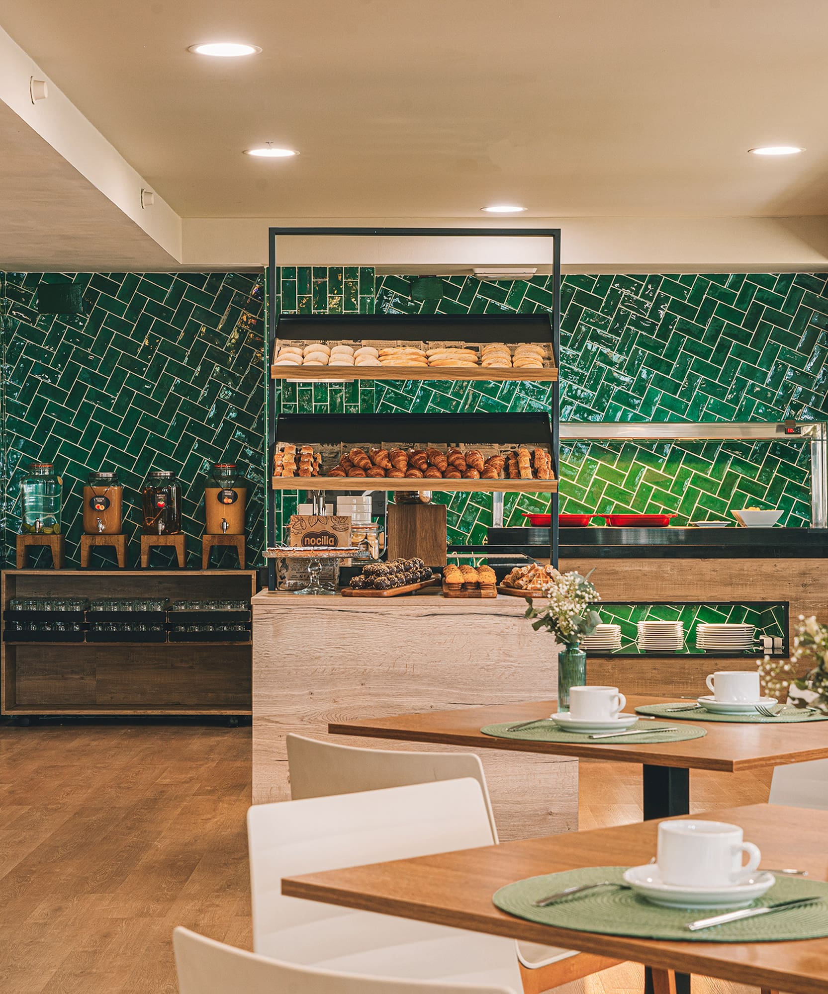 a room with a green wall and a table with food