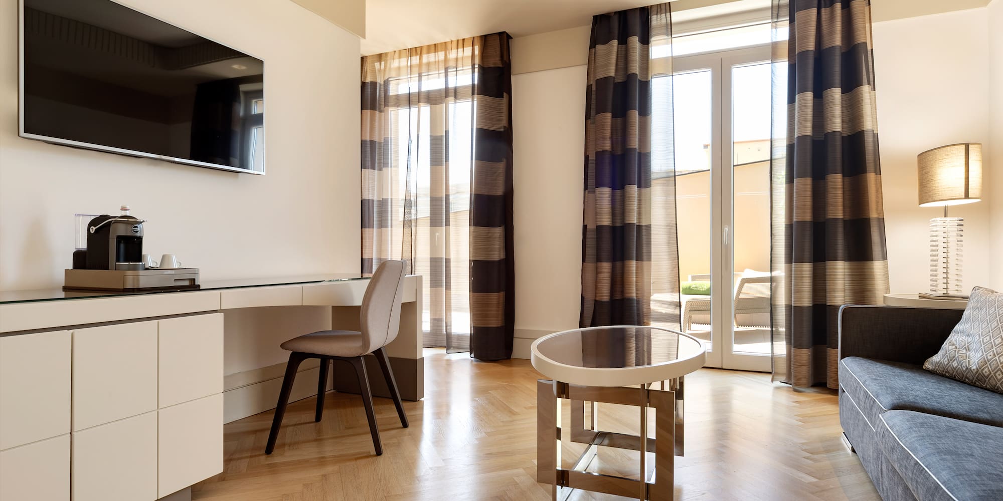 a room with a desk and a television