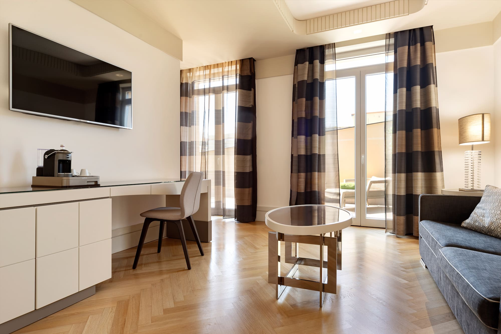 a room with a desk and a television